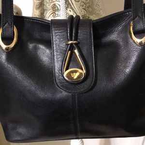 Vicosta leather shoulder bag with gold tone hardware. Vintage!